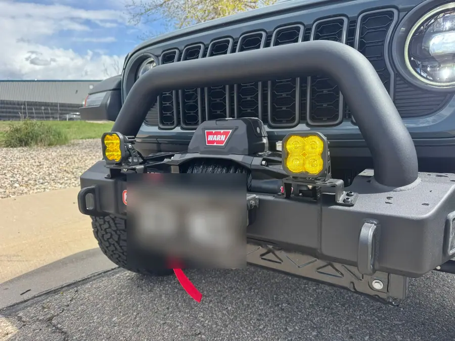 ARB Stubby front bumper with a Warn 10S winch and amber Diode Dynamics SS3 pods on a Jeep Wrangler
