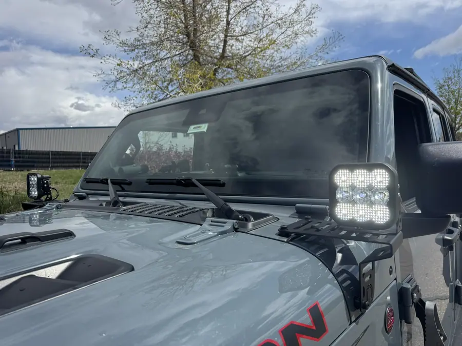 Diode Dynamics SS5 pods on cowl mounts on a Jeep Wrangler Rubicon