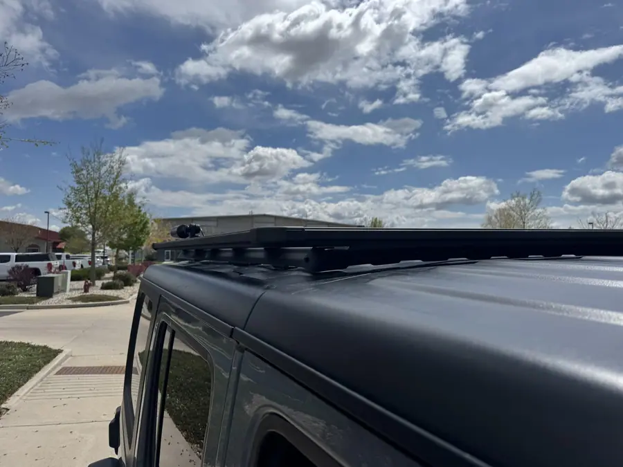 ARB roof rack mounted on the hard top of a Jeep Wrangler