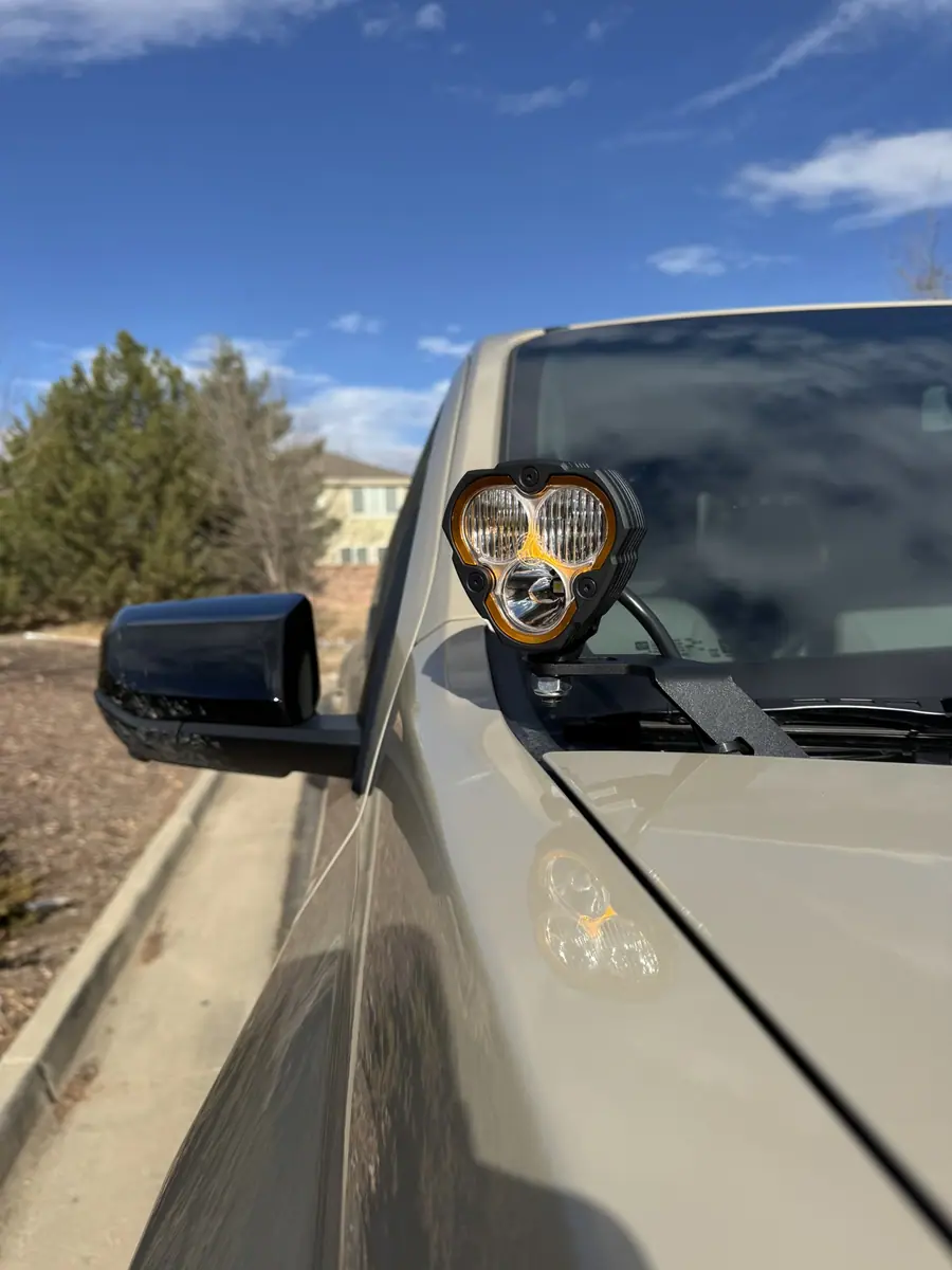 KC LED pod lit on a Chevy Colorado ZR2 cowl mount