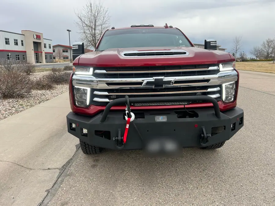 Front view of a Chevy Silverado 2500HD with a Hammerhead steel bumper and winch