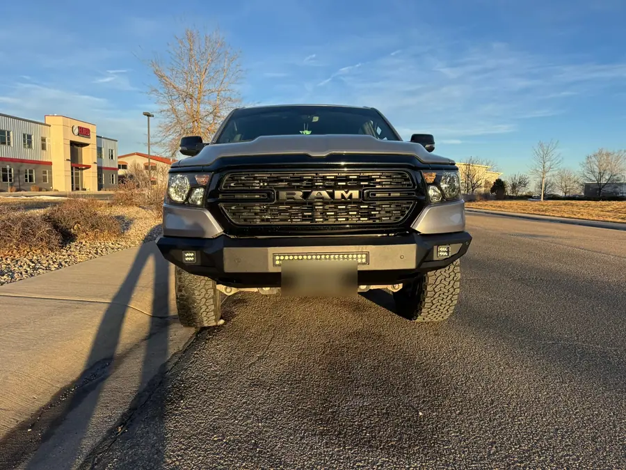 Front of a Ram 1500 with its bumper light bar lit