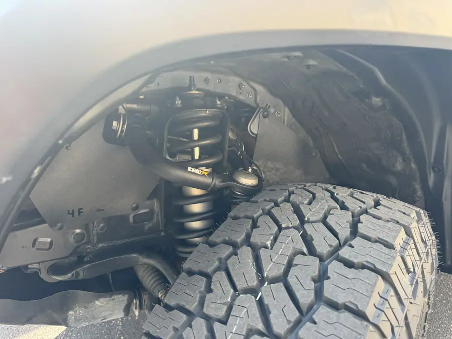 Old Man Emu MT64 front coilover installed on a Toyota Tacoma