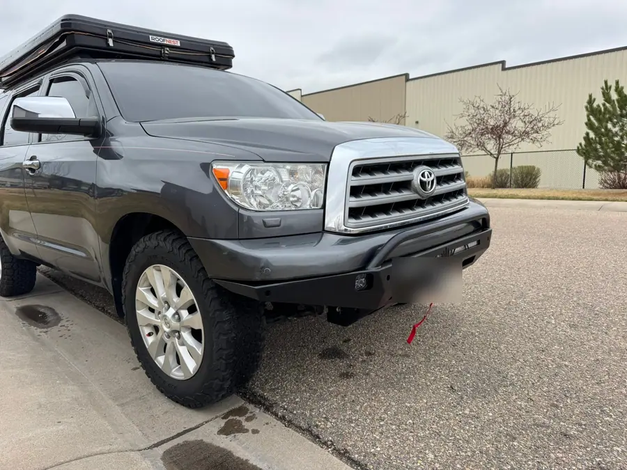 Steel front bumper with an integrated winch on a Toyota Sequoia, side angle