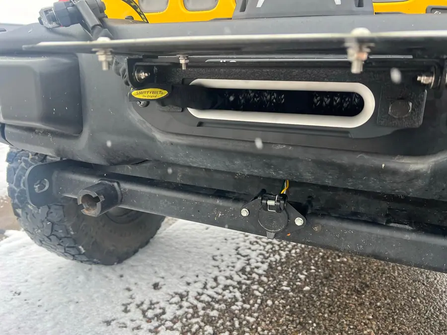 Smittybilt Gen 3 winch mounted in the factory steel bumper of a Jeep Wrangler Rubicon
