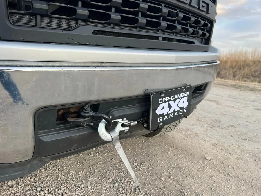 Hidden winch mount and fairlead behind the factory bumper of a Chevy Silverado