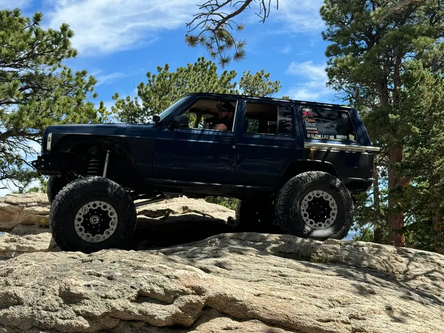 Lifted Jeep Cherokee XJ on a granite slab