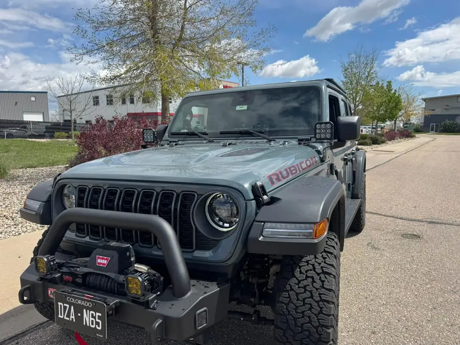 Jeep Wrangler with a MetalCloak-style front bumper and lighting