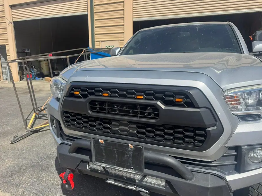 Front bumper and grille on a lifted truck