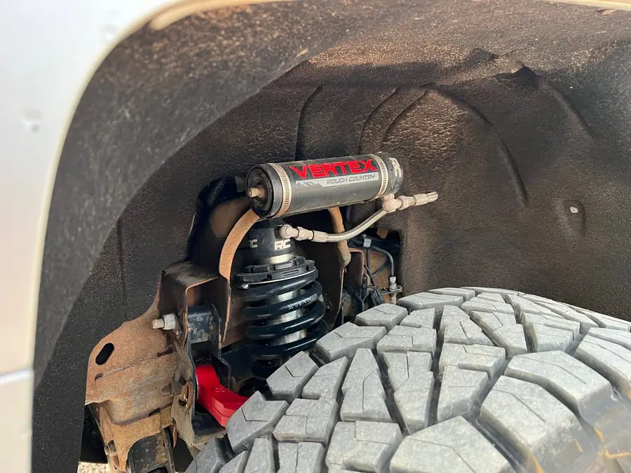 Shock and spring install under a lifted rig