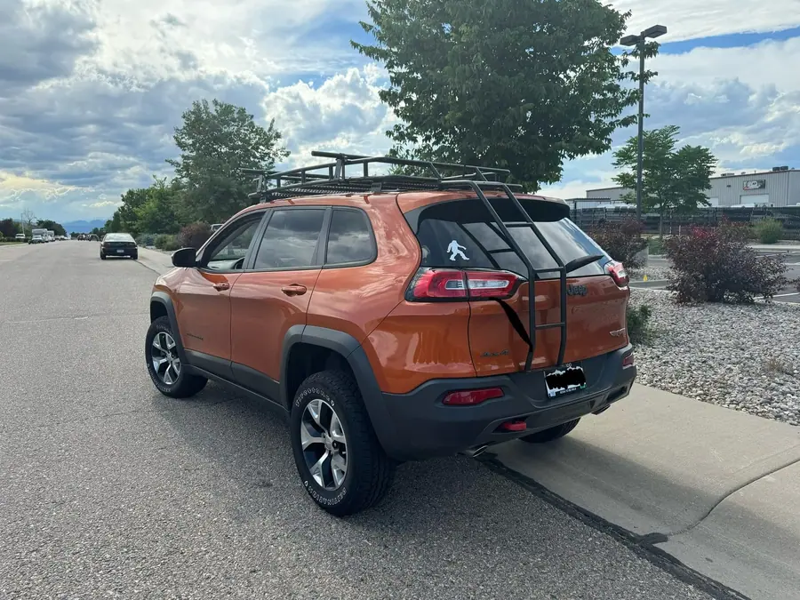 Jeep Cherokee with a roof rack and basket