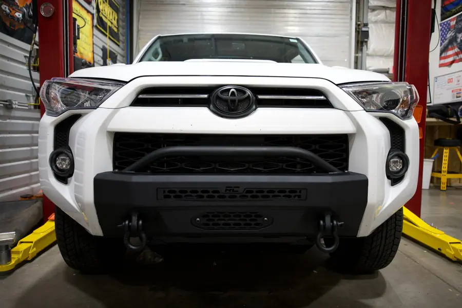 Rough Country front bumper on a white Toyota 4Runner in the Off-Camber shop