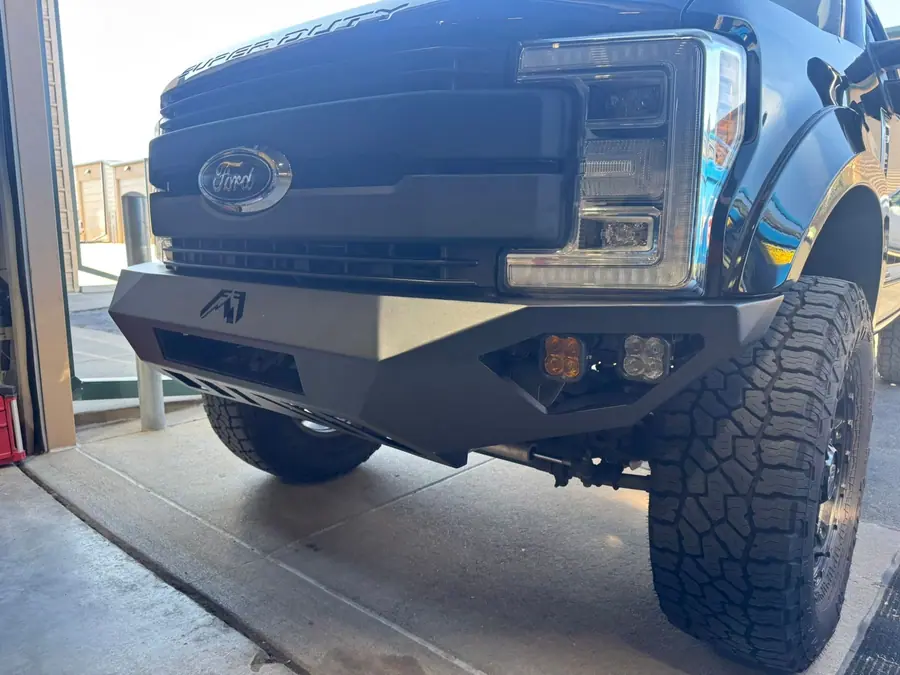 Fab Fours front bumper on a black Ford Super Duty