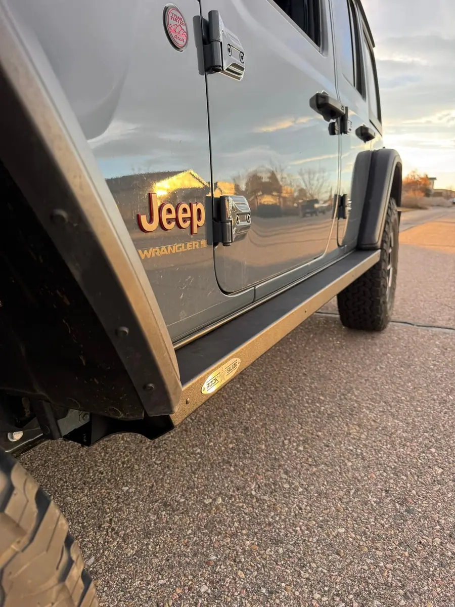 Rock Slide Engineering step slider on a gray Jeep Wrangler JL