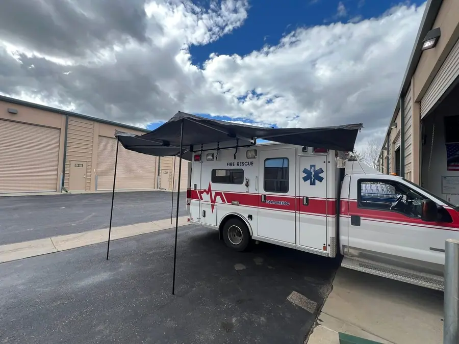270-degree awning deployed off a converted ambulance camper