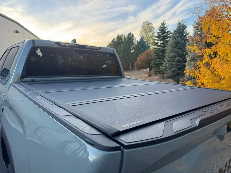 Hard folding tonneau cover on a silver Toyota Tundra