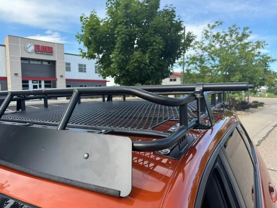 Gobi roof rack with a wind fairing on an orange Jeep Cherokee