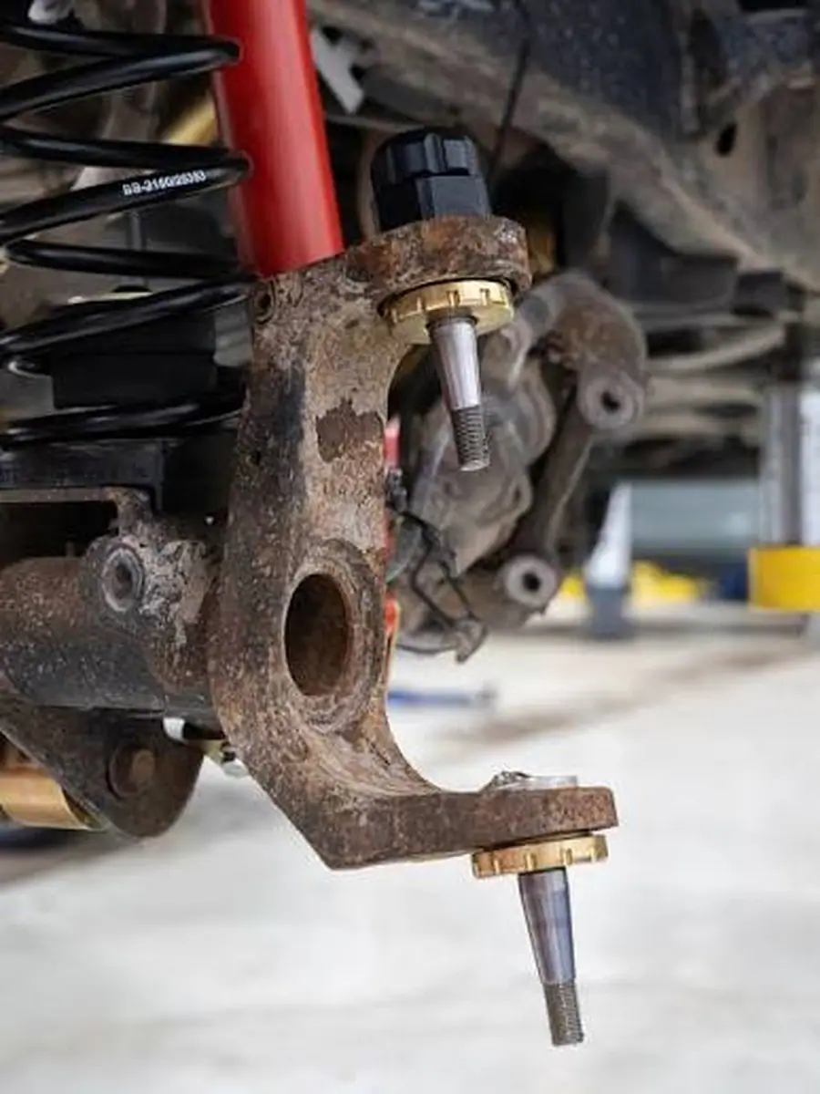 Jeep front knuckle with new MetalCloak upper and lower Baller Joints installed