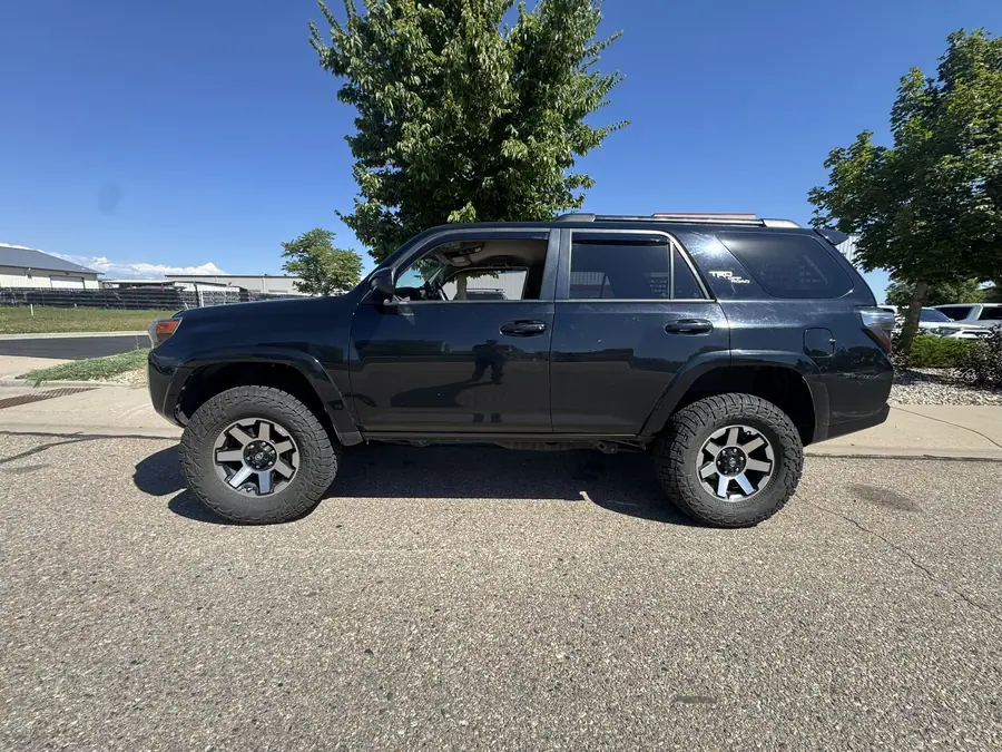 Dark gray 5th gen Toyota 4Runner TRD with a leveling kit and all-terrain tires